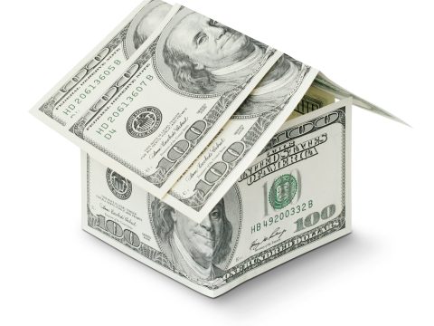 Una casa hecha de dinero que representa el valor en UF